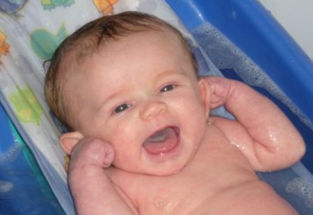 Bath time is always fun with those smiles!